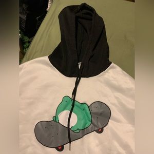 Black and white hoodie. Frog riding skateboard. Black draw strings.